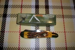 Frost Whitetail Amber Bone Dogleg Trapper Pocket Knife.. Fixed Price $18.00.