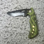 Ampro Folding Knife Black Partial Serrated Blade Green Camouflage Handle. Fixed Price $14.99.