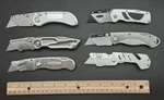 Set Of 6 Folding Utility Knives Including Craftsman & Husky W/new Blades. Fixed Price $26.99.