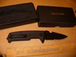 Hurricane Rescue Flipper Knife 3.5" Part. Serrated Blade Black Handle 8"OA. Fixed Price $14.99.